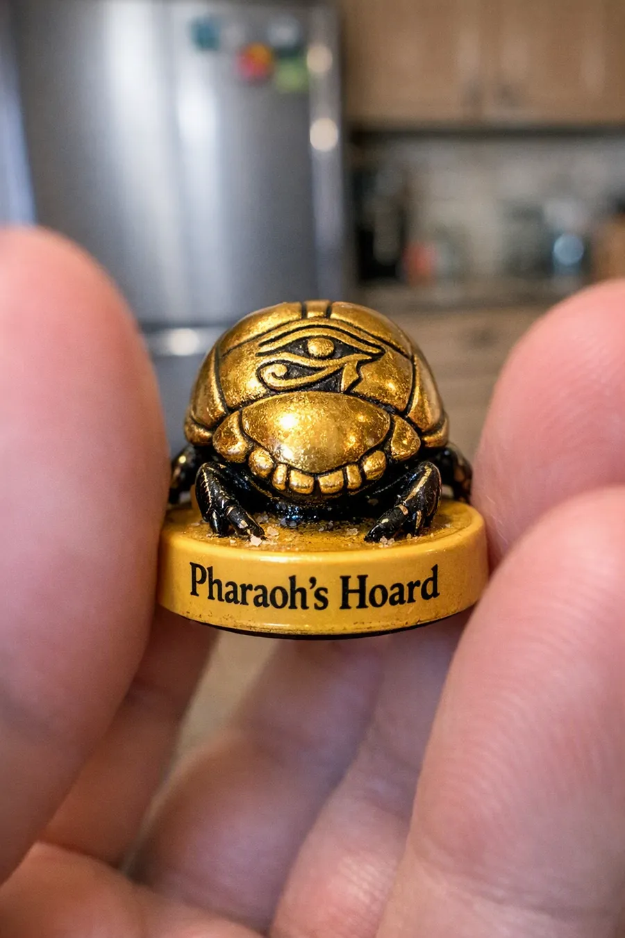 A photo of a small souvenir barrel re-rendered as a golden scarab game token